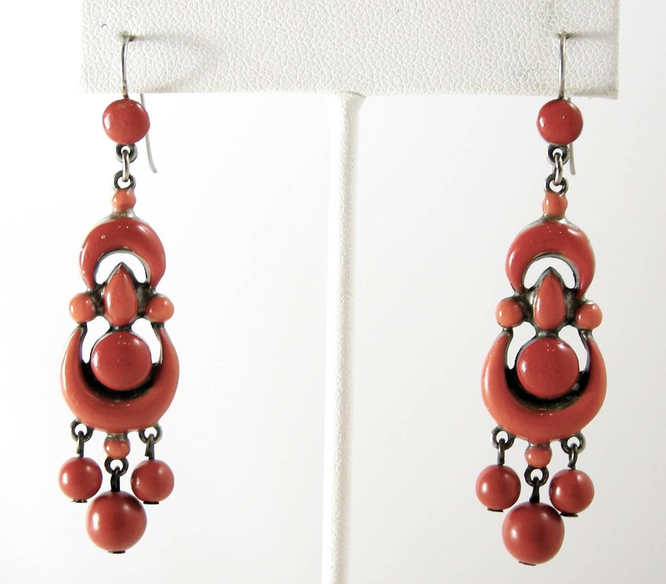 These RARE Victorian earrings are stunning. They are made with beautiful red coral enamel. In excellent condition, they measure 2  2/8”x 2/8: and have a silver tone setting.