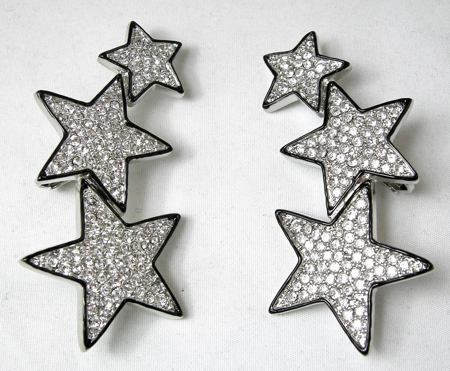 Stars are not only in the sky…but are fantastic on your ears.  These Kenneth Jay Lane star clip earrings have 3 stars graduating in size.  Each star is encrusted with rhinestones with black enamel borders.   They are nickel free and made with a