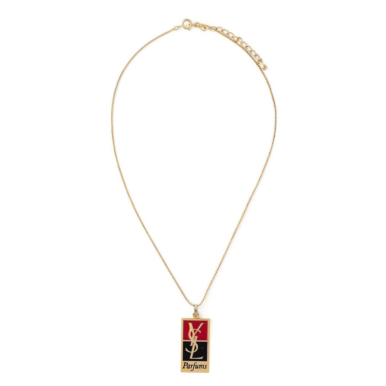 This vintage YSL necklace features a Gold-tone, Red and Black Metal logo pendant, a rope chain and a torque closure.

Measurements: Length: 20cm, Pendant Length: 3cm, Pendant Width: 1.5cm

Material: Metal

Colour: Gold-tone, Red and Black