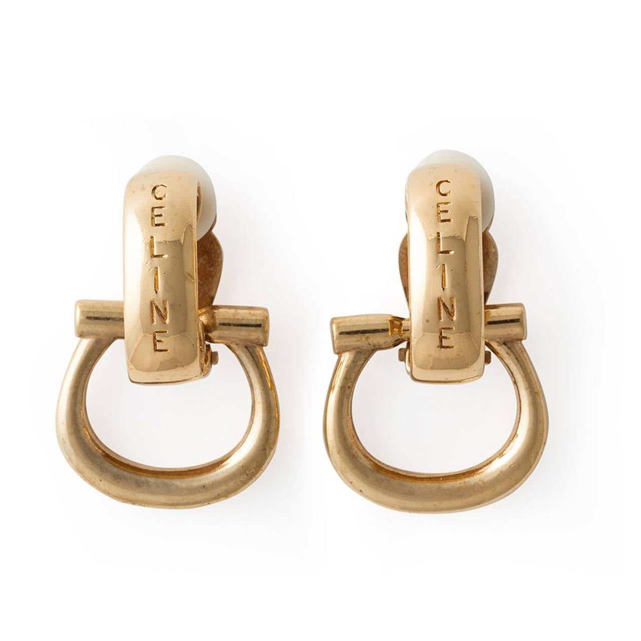 These vintage Gold-tone earrings from Céline come with two pairs of pendants that can be swapped, these both feature the brands iconic logoing.

Measurements: Height: 4cm, Width: 2.5cm

Material: Gold-tone Metal

Colour: Gold