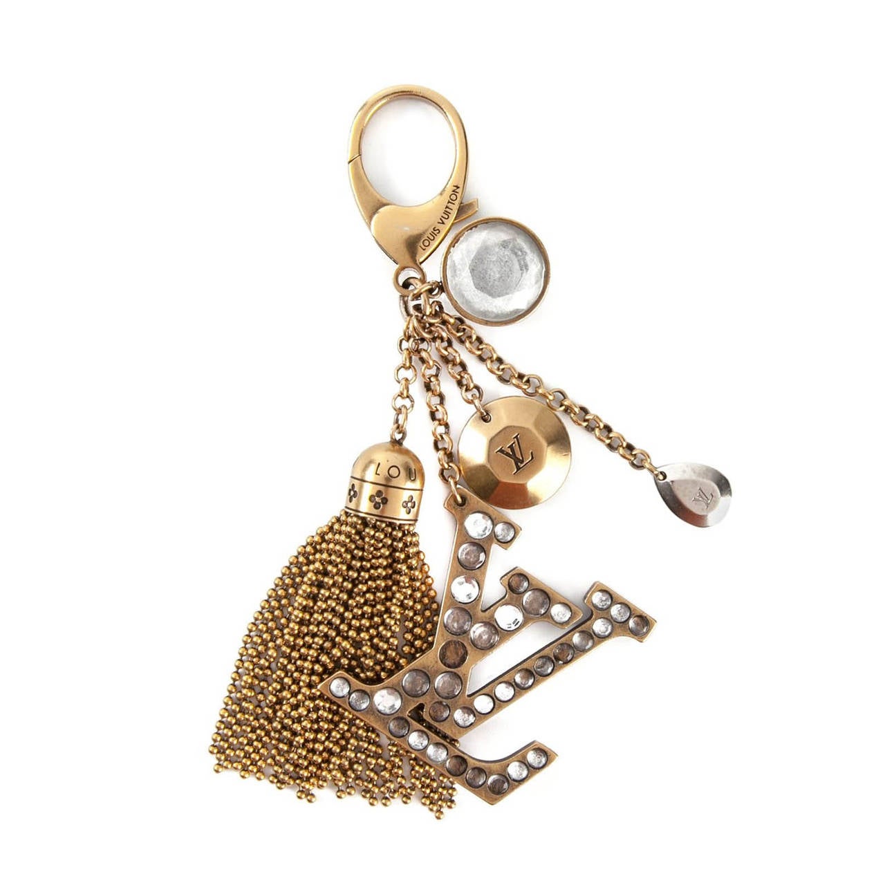 This Gold-tone logo charm keychain from Louis Vuitton features crystal accents, a clip fastening and a tassel charm.

Material: Metal

Colour: Gold, Clear