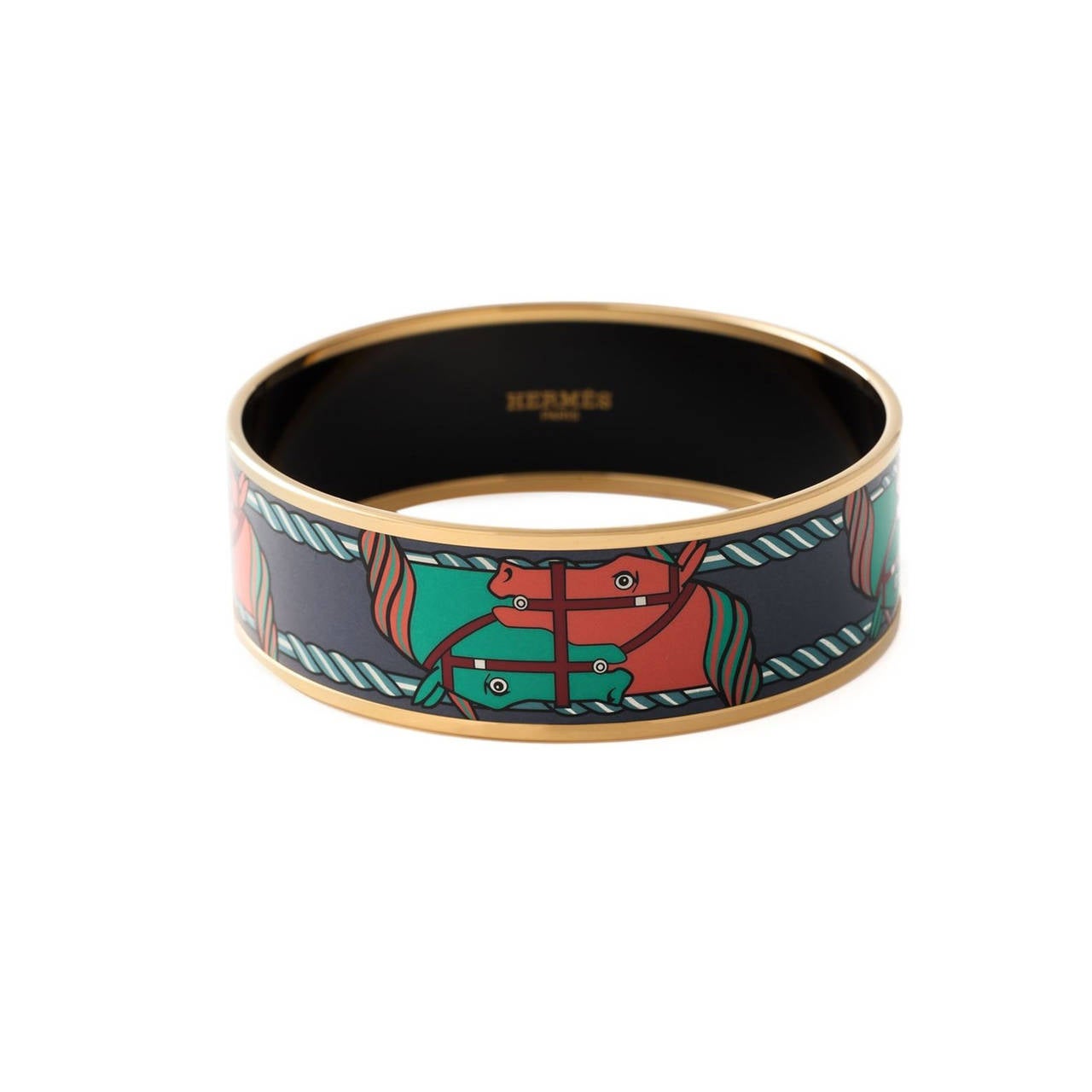 Multicoloured horse bangle from Hermès features enamel details, an embossed internal logo stamp and a gold-tone lining.

Measurements: Circumference: 21 cm

Material: Resin, Material

Colour: Multi, Gold