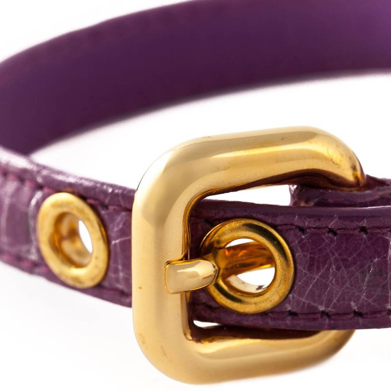 This Miu Miu bracelet features a gold-tone buckle fastening, gold-tone hardware and an embossed logo heart pendant and comes in Purple Leather.

Measurements: Circumference: 17.1 cm

Material: Leather

Colour: Purple