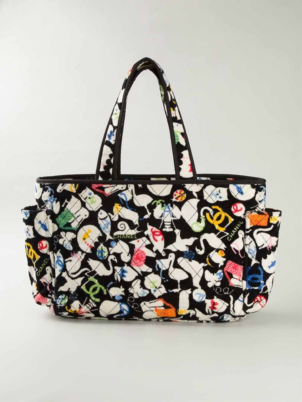 This vintage multicoloured cotton animals print terrycloth tote from Chanel features a classic shape, stitching details, side pockets, a back zip pocket, top handles, a top zip fastening, an internal logo stamp, an internal zipped pocket, a cat