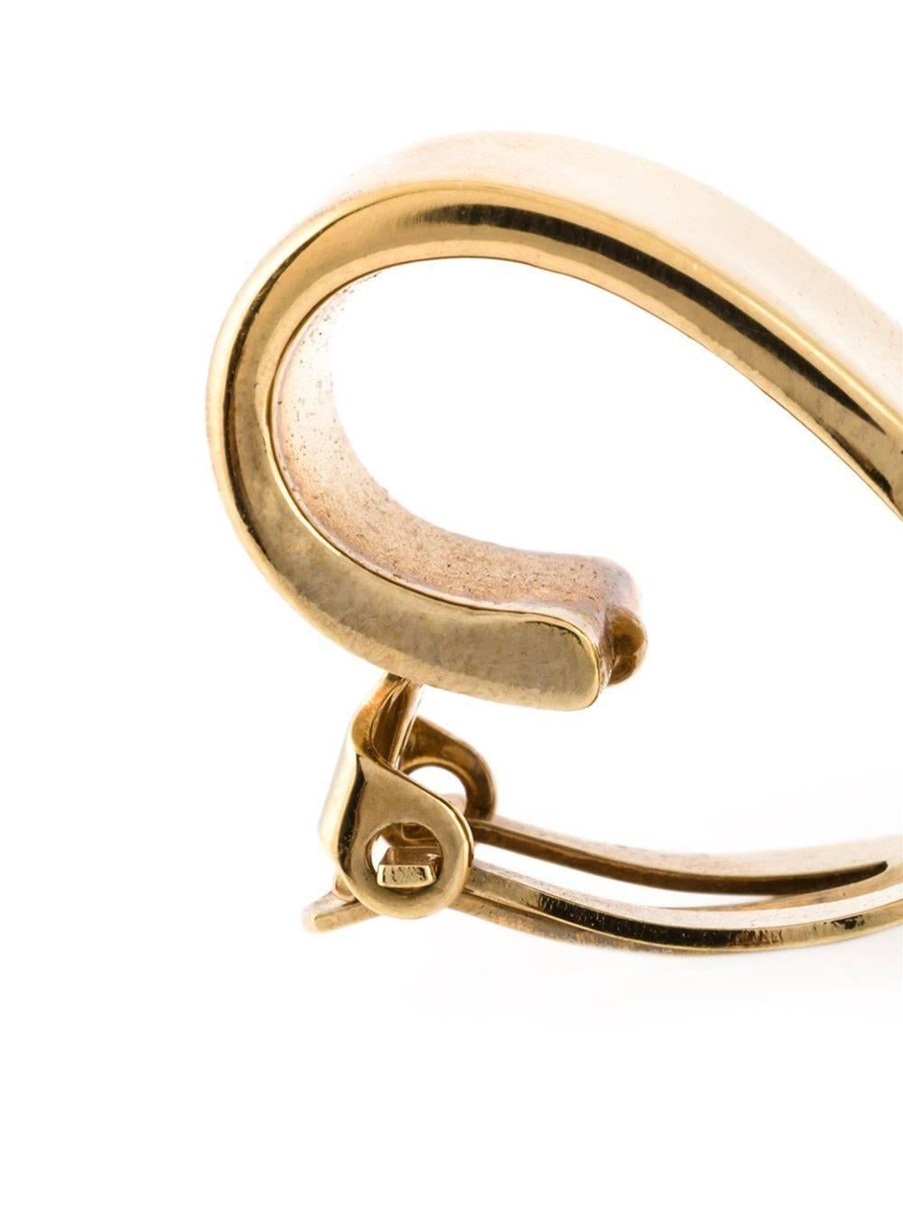 Gold-tone logo engraved mini hoop earrings from Céline Vintage featuring a clip on fastening. 

Colour: Gold

Material: Gold-plated metal, glass

Measurements: width: 1.5 centimetres, length: 2 centimetres

Condition: Excellent
Light
