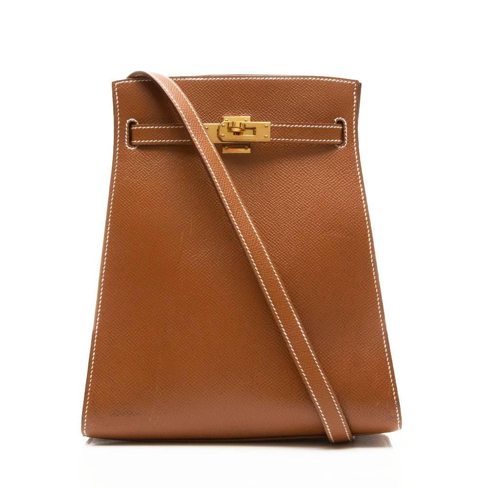 Hermes Kelly Sport Shoulder bag in 'Gold' epsom leather, featuring gold- plated hardware, this bag has two open interior pockets and an adjustable shoulder strap.

Colour: 'Gold'

Material: Epsom leather

Measurements: W: 20cm H: 24cm D: