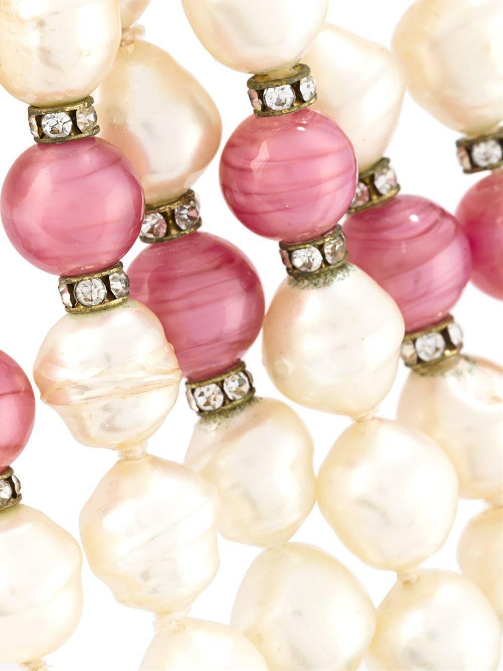 White, pink and blue pearl bead necklace.

Colour: White / Pink / Blue

Material: Pearls

Measurements: W: 5cm, Circumference: 43.2cm

Condition: 9 out of 10
Excellent