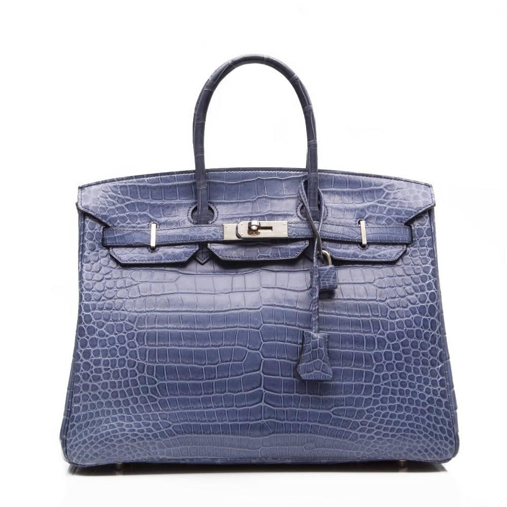 Hermes Porosus crocodile leather Birkin bag in matte Brighton Blue featuring Palladium hardware. The interior of the bag is lined in goats leather and has one open and one zipped pocket. 

Stamp:M (2009)

Colour:Brighton Blue

Condition: 8.5