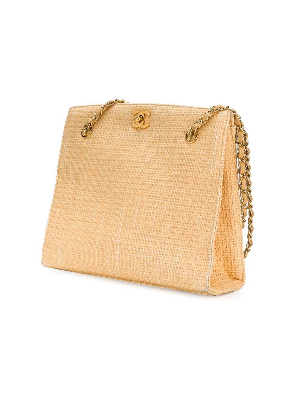 Yellow straw shopper tote featuring a trapeze body, a woven design, a gold-tone logo plaque, a chain and leather strap and a gold-tone twist lock fastening. 

Colour: Yellow

Material: Straw 100%

Measurements: Handle: 24cm, W: 27cm, Depth: