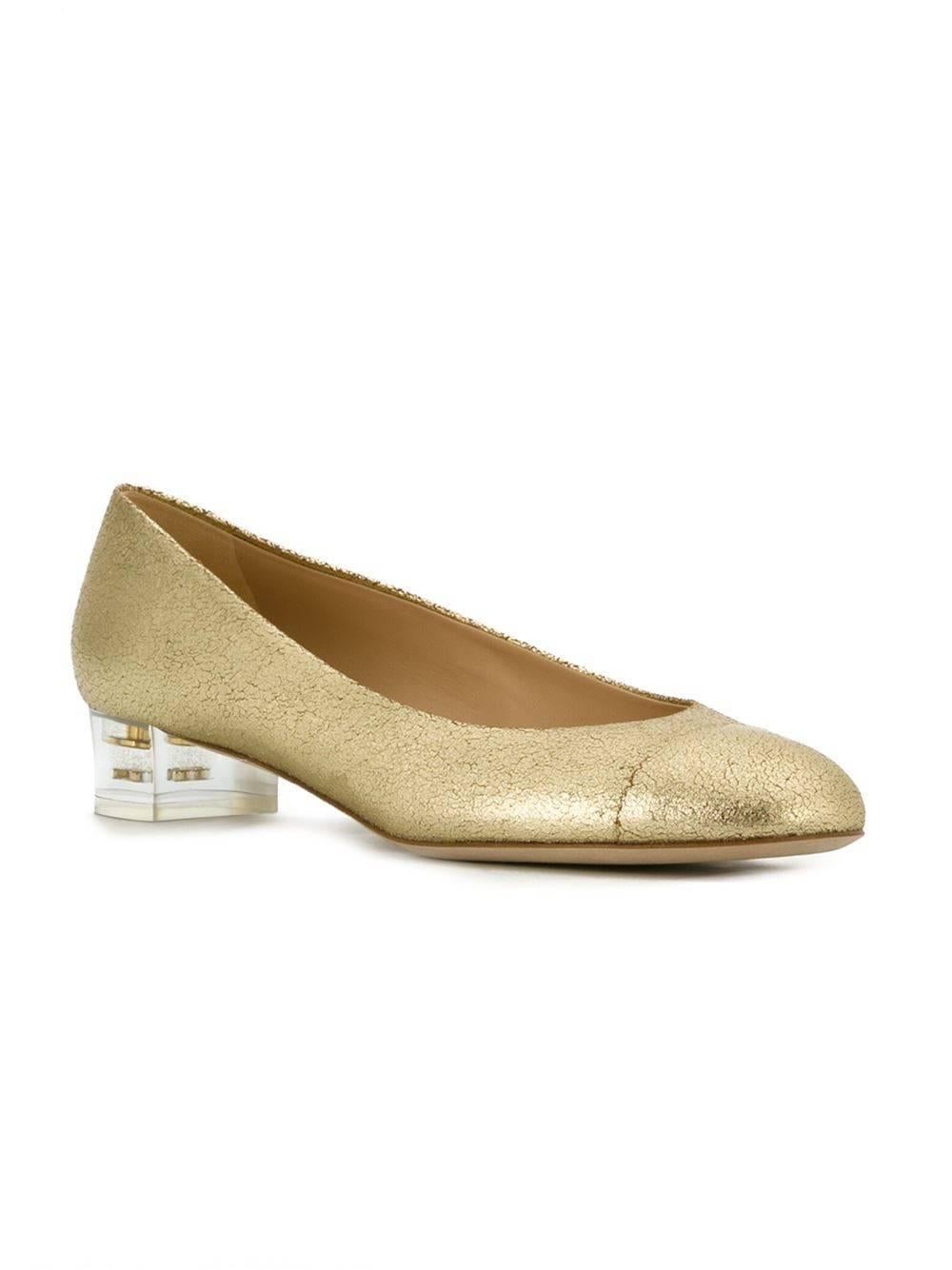 Gold-tone leather transparent heel pumps featuring an almond toe, a branded insole, a low block heel and a signature toe cap detail. 

Colour: Gold-tone

Material: Leather 100%

Measurements: Heel: 3.5cm Size: EU 40

Condition: Excellent