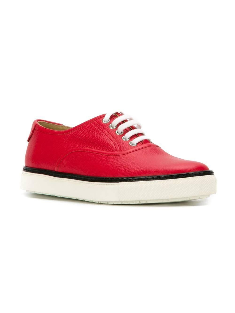 Red leather colour block low-top sneakers featuring an almond toe, a contrast piped trim, a brand embossed insole, a lace-up front fastening, a flat rubber sole and a back embossed logo stamp. 

Colour: Red

Material: Leather