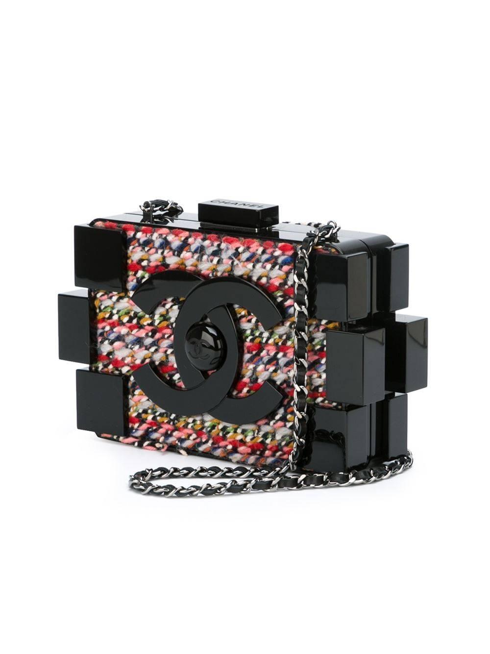 Black wool and plexiglass 'Lego' crossbody bag from Chanel Vintage featuring a top clasp fastening, a chain and leather strap, an internal zipped pocket, an internal logo stamp and multicoloured tweed panel.

Colour: Black, multi

Material:
