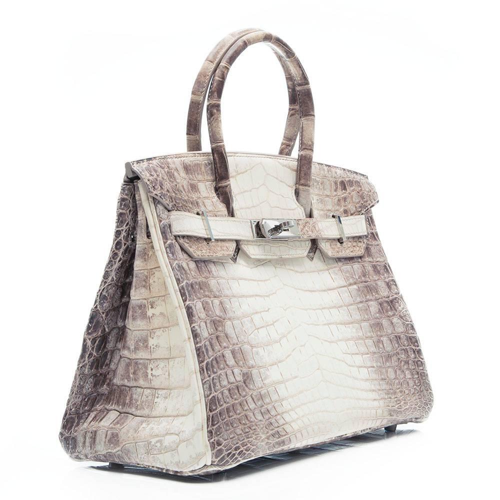 Hermes Himalaya Birkin Bag in matte Niloticus Crocodile leather featuring palladium hardware. The interior of the bag is lined in gray goat leather and has one zipped and one open pocket.

This bag comes with its original dust bag, raincoat and