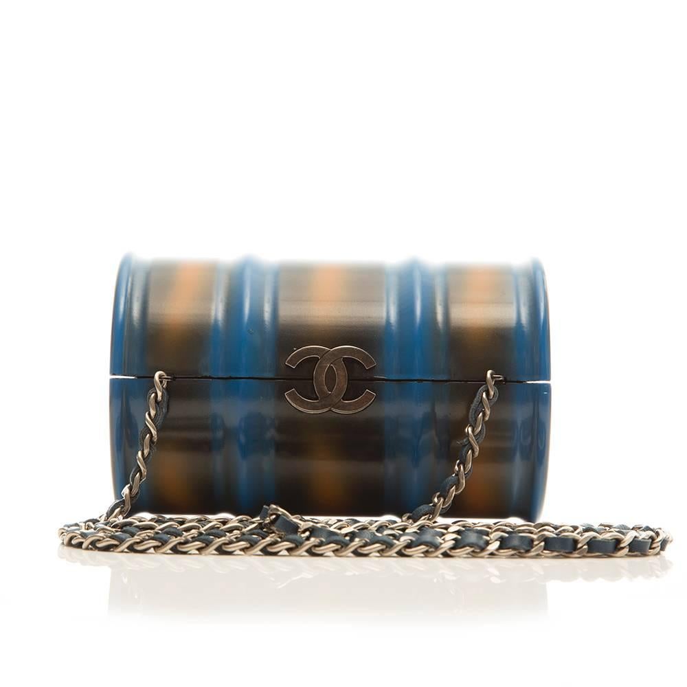 Chanel Oil drum bag featuring a spray paint effect finish and antiqued silver-tone hardware. The bag is lined in black leather and can be worn over the shoulder or as a clutch.

Colour: Blue/ Multi

Material: Plastic, metal

Measurements: W: