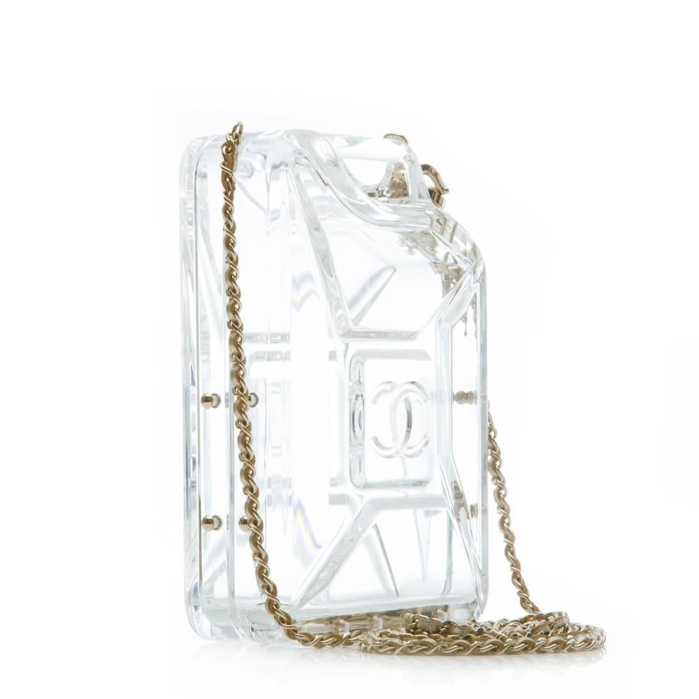 Chanel Gas Tank bag in clear plexiglass featuring pale gold tone hardware and a woven leather shoulder strap. The tank's nozzle acts as a latch.

Colour: clear, pale gold

Material: plexiglass

Measurements: W: 12cm H: 17cm D:
