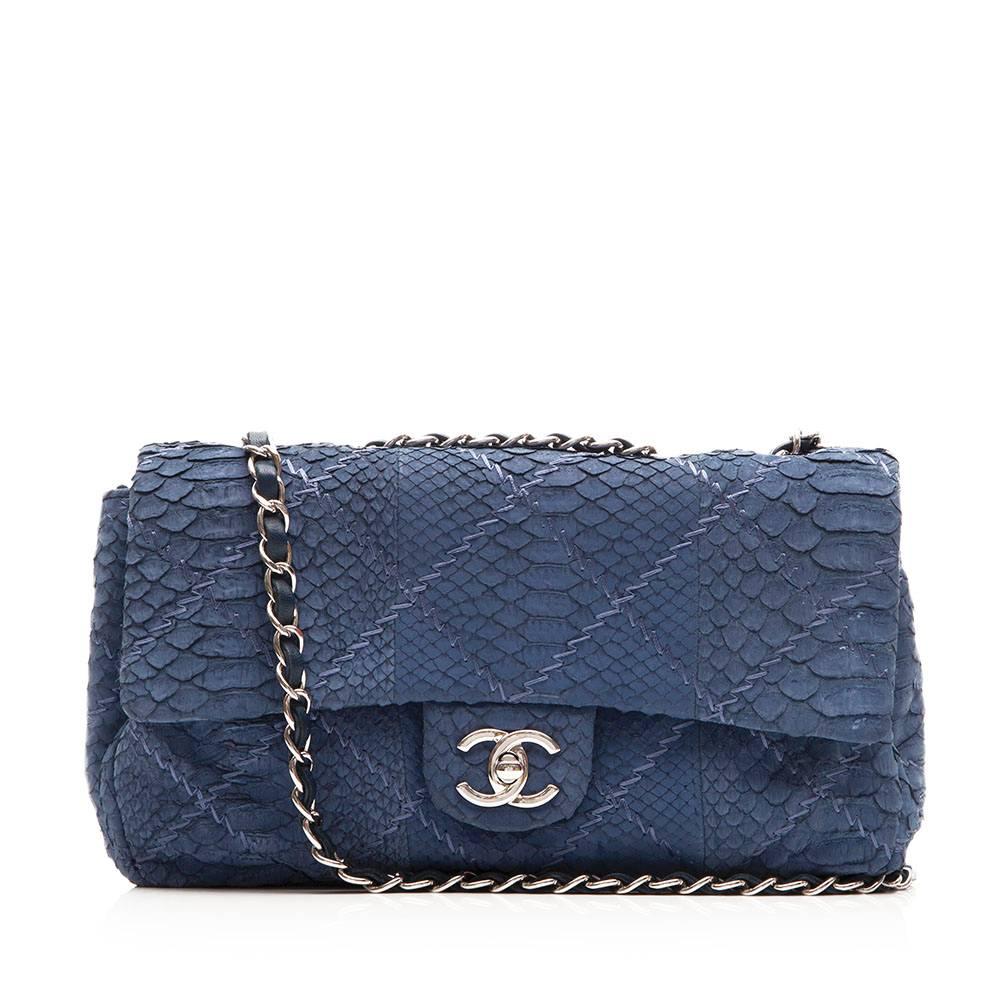 A stunning reimagining of the iconic Chanel 2.55 handbag. Crafted in rippling, blue python skin – a denim hue that gives the bag a perfect lease to accent an off-duty look time and time again. Featuring a double woven-chain shoulder strap, the