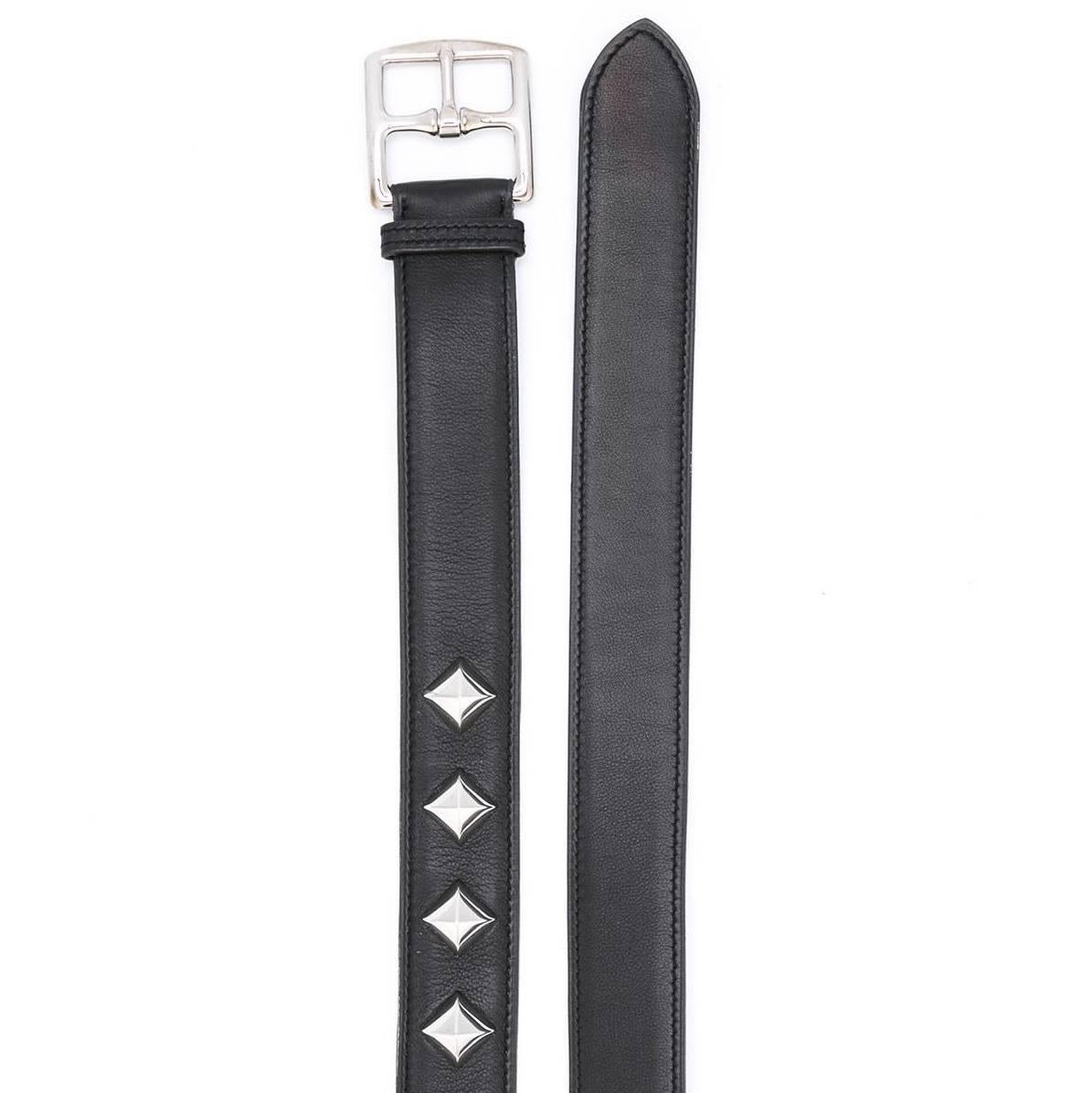 Liven up your ensemble with a darkly glamorous edge. Hermès brings luxury to punk in this vintage belt that marries black leather with large silver-tone studs. 