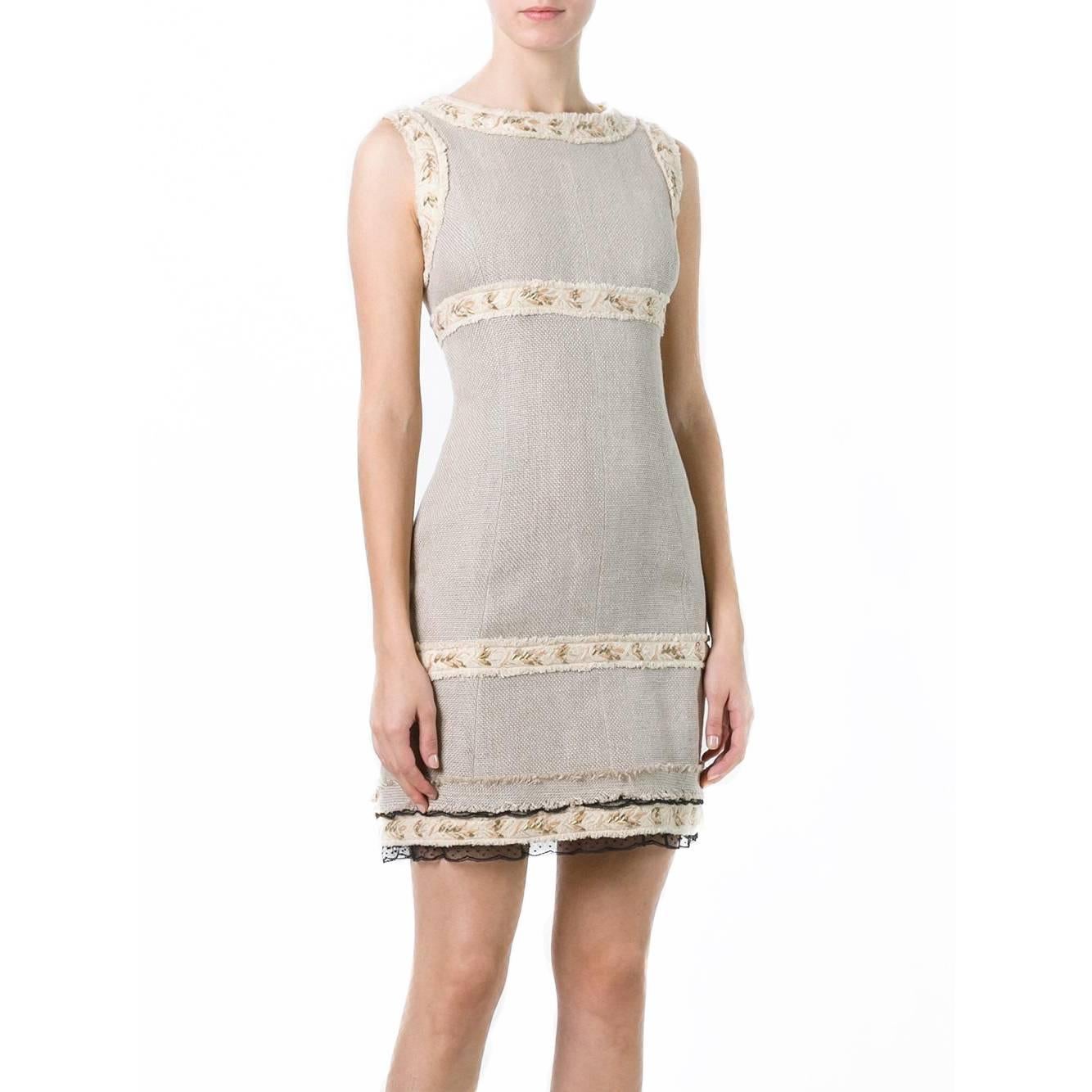 Discover the rustic romance of Chanel’s spring/summer 2010 barnyard extravaganza with this vintage Chanel sleeveless dress. Cut from hessian, this dress is amped up in true Chanel form with gold-gilded trims, black lace hems and frayed edges.

All