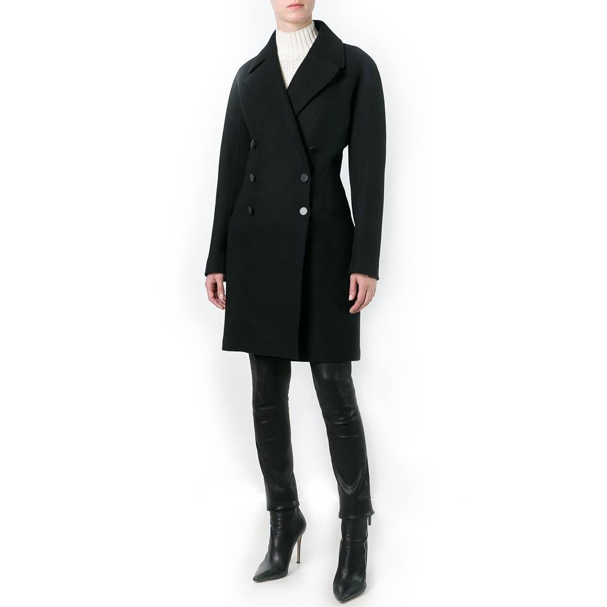 Bring the iconic elegance of Alaïa to your wintery wardrobe. This vintage Alaïa black double-breasted wool coat is tailored to sculptural perfection, finished with the house’s typical flattering style lines.