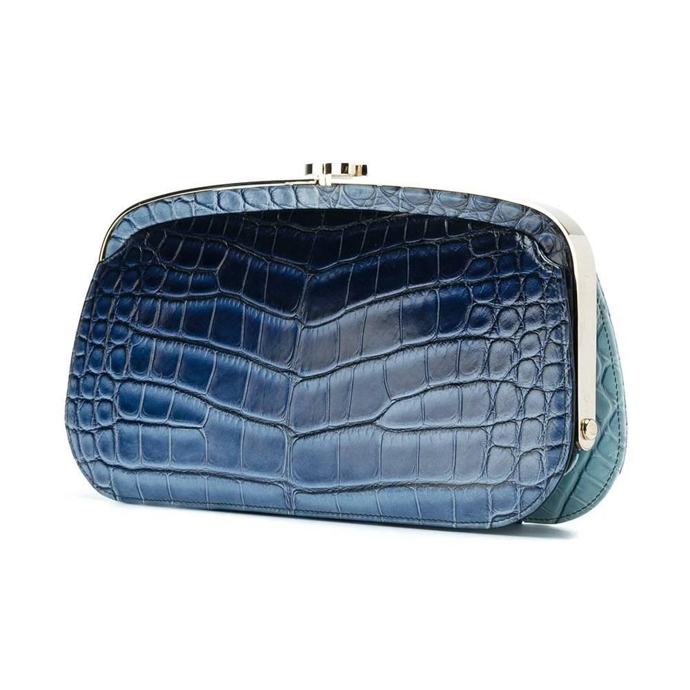 This rare and stunning maroquinierie derives from Chanel's marine-inspired Cruise 2014 collection. Crafted with a precious, matte alligator skin exterior, the hard-cased body features a unique and subtle ombre patterning that gently fades between
