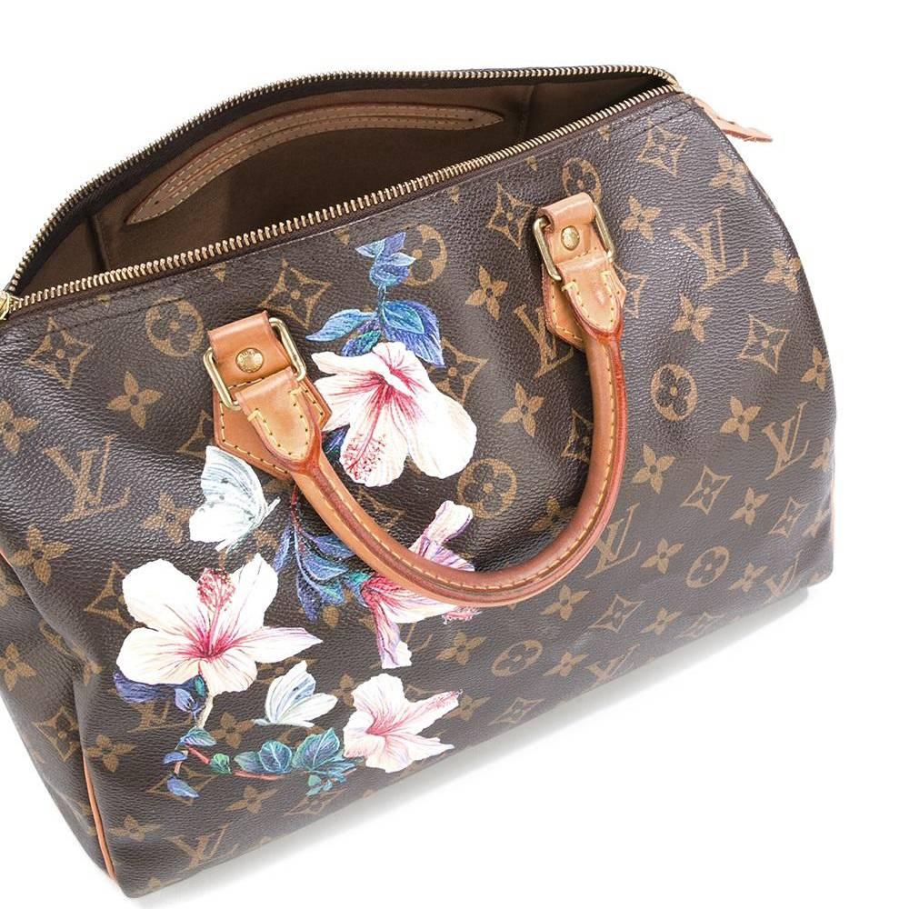 Brown leather 'Speedy 30' tote from Louis Vuitton Vintage featuring a monogram pattern, a top zip fastening, round top handles, an internal slip pocket and a hand painted floral print.

Measurements: handle: 11 centimetres, depth: 18 centimetres,