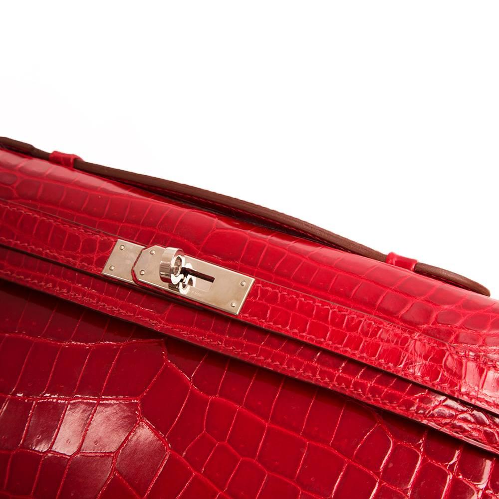 Hermes Braise Red Kelly Cut in shiny Porosus Crocodile withsilver​ hardware. 1