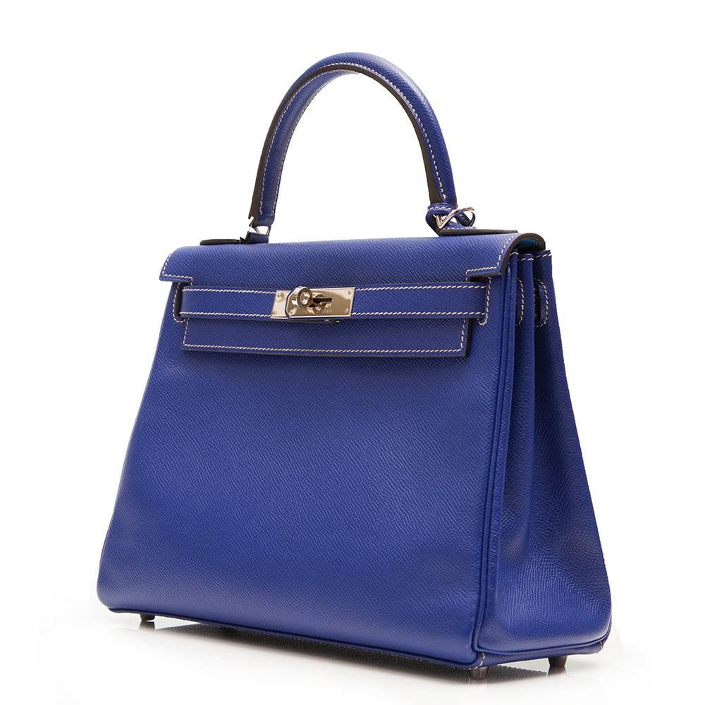 
In a highly sought-after compact size, this Hermès Kelly 28 bag makes a beautifully feminine statement. Crafted from a Bleu Iris Epsom leather, it is finished with palladium hardware and cream stitching. Its goatskin lining is shaded in turquoise