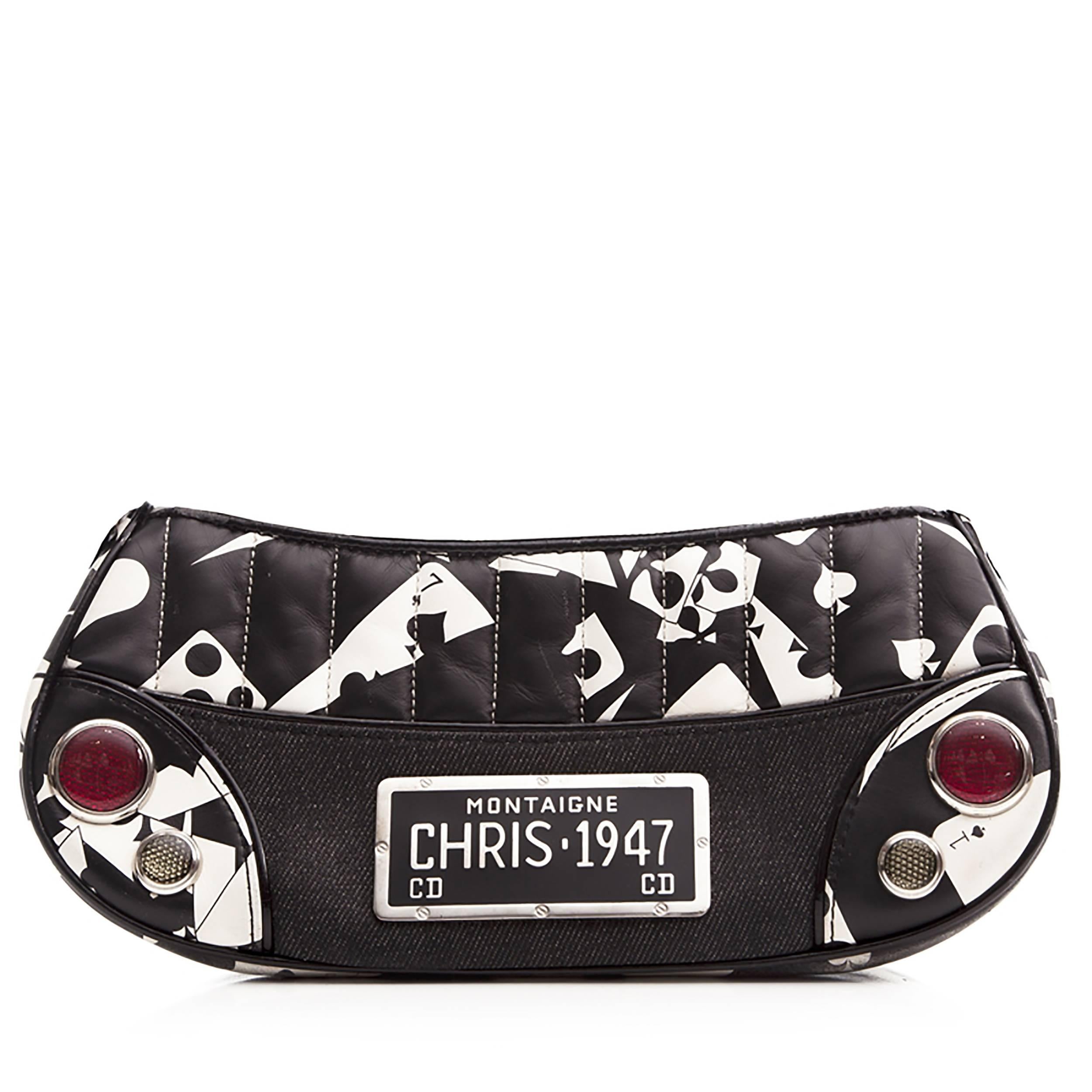 This playing-card patterned bag from Christian Dior is an ace accessory. Its denim and quilted leather exterior is finished with a black patent strap, and a metal Christian Dior plaque placed front and centre. Its interior holds one zipped
