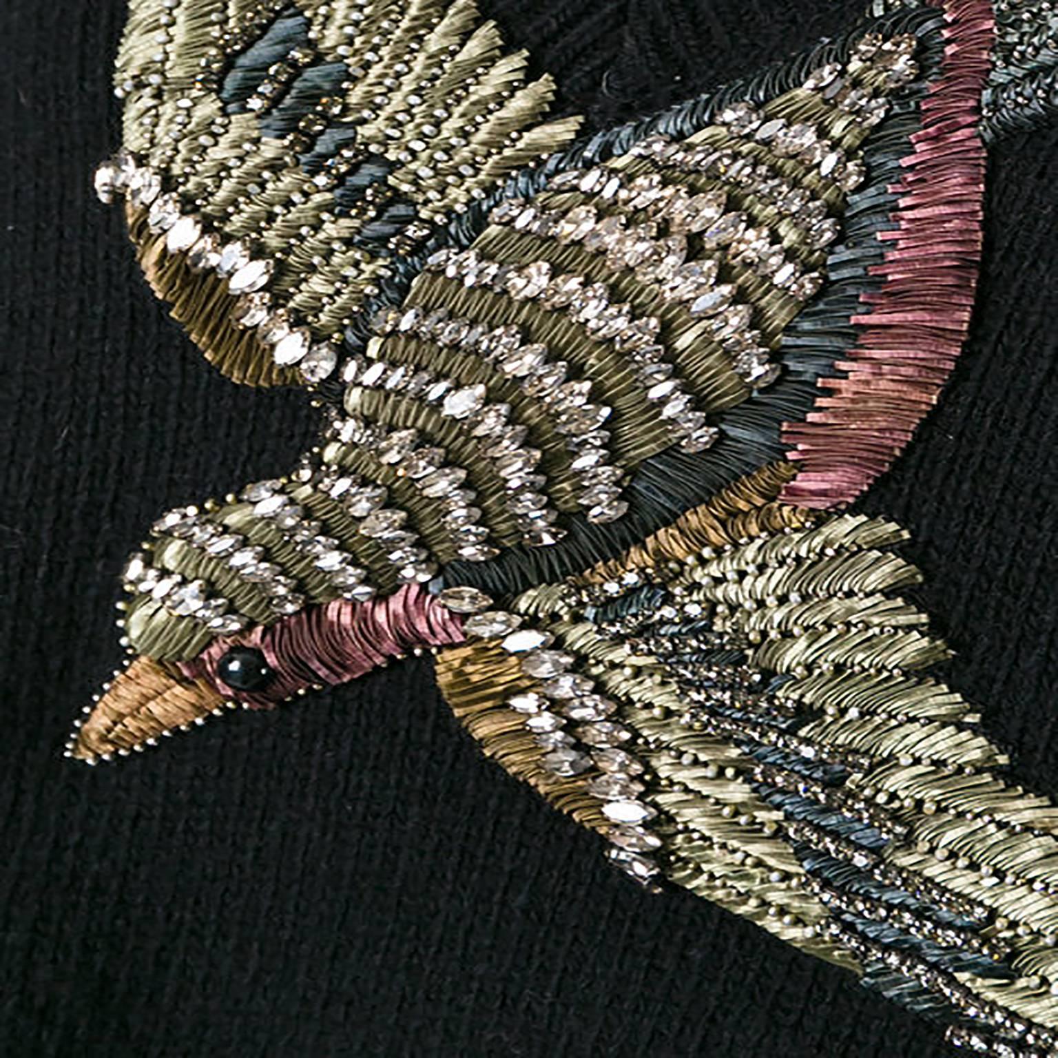 Alessandro Michele’s new creative direction at Gucci is full of ornate details and romantic flourishes. This Gucci jumper showcases this beautifully, with an appliqué bird across its black woollen front. The jumper has a slightly relaxed fit and a