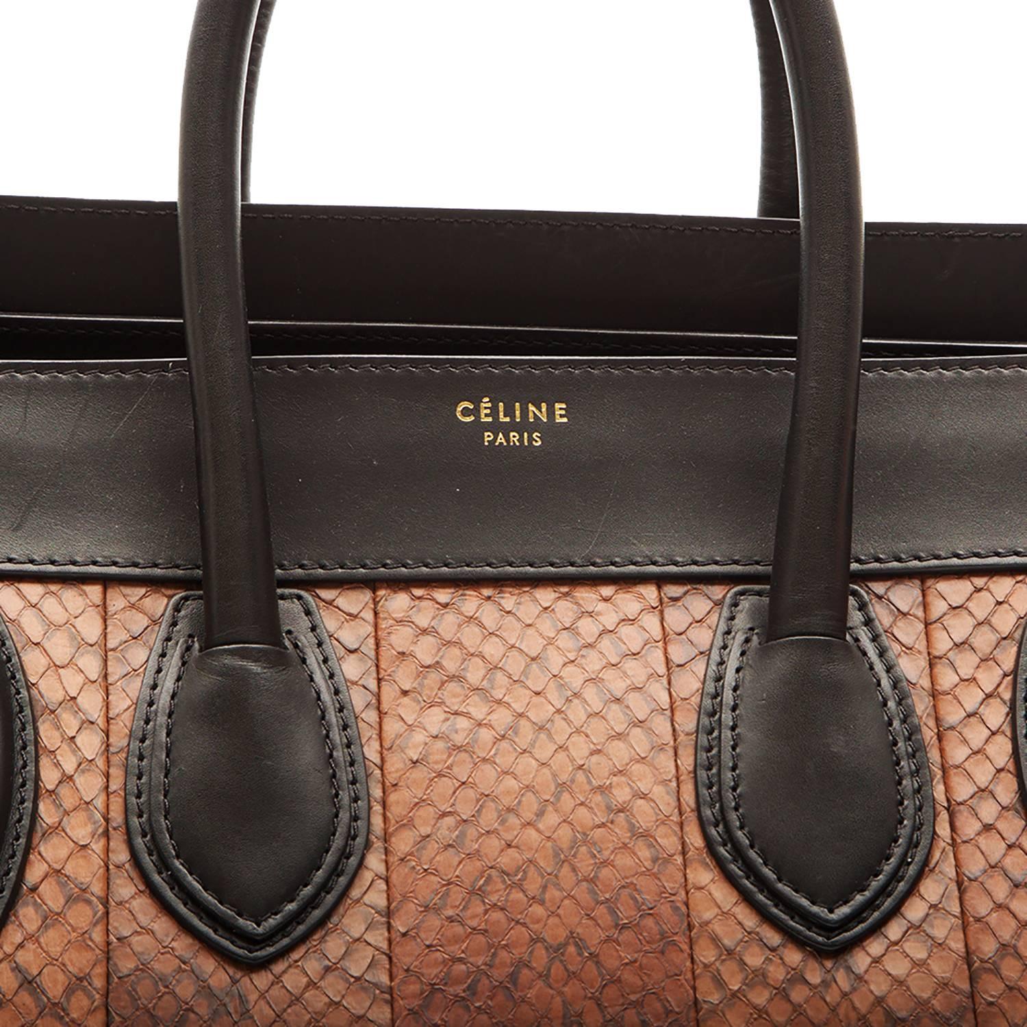 In its largest size, this edition of the iconic Céline bag features brown panels against black and white calfskin. Offset with gold-tone finishings, it features Céline branding across its profile, a zipper closure, an outer zipper pocket, and three