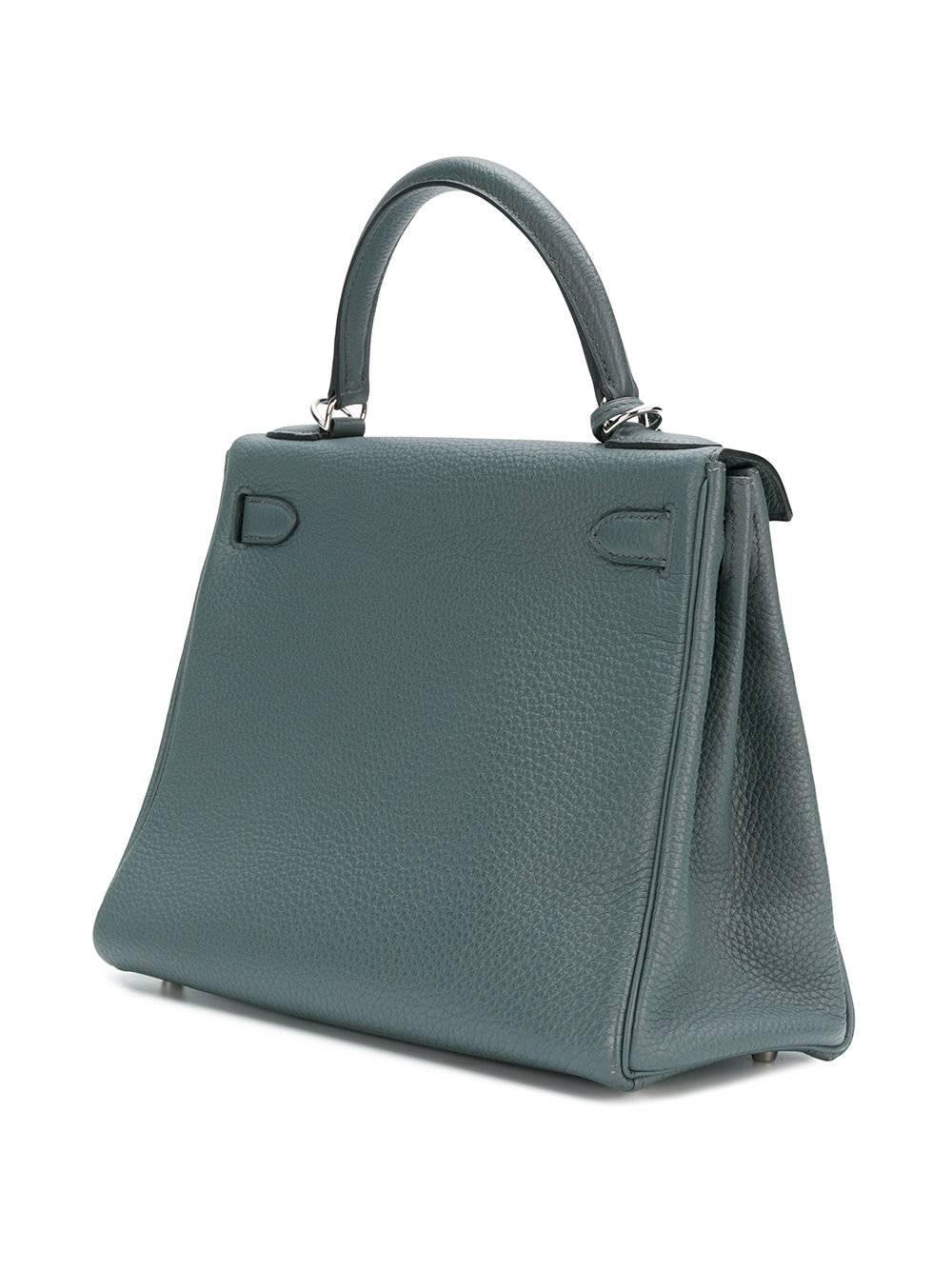 This exquisite Hermes 25cm Kelly bag is crafted in France from a beautiful togo leather. This fun-size Kelly bag features a round top handle, a foldover top with the iconic Hermès twist-lock closure, an internal zipped pocket, a structured design