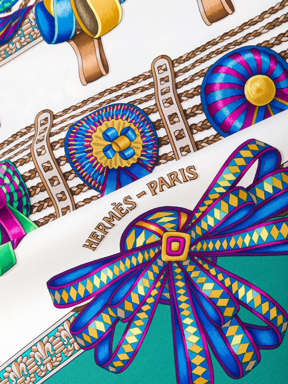 Hermes Les Rubans du Cheval Scarf in bold multicolours made from 100% Silk. Featuring patterns of bright bows, ribbon and classic Hermes motifs.

Colour: Multicolour

Material: 100% Silk
