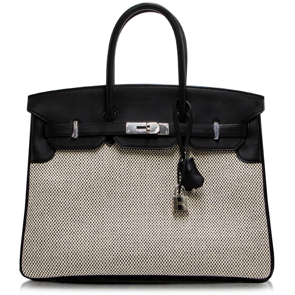 Invest in a very rare and limited edition piece with this Hermes Birkin, crafted in luscious Black Swift Leather and elegant Ecru-Graphite Criss Cross Toile. Lined with a matching goatskin leather, this spaciously sized bag features two interior