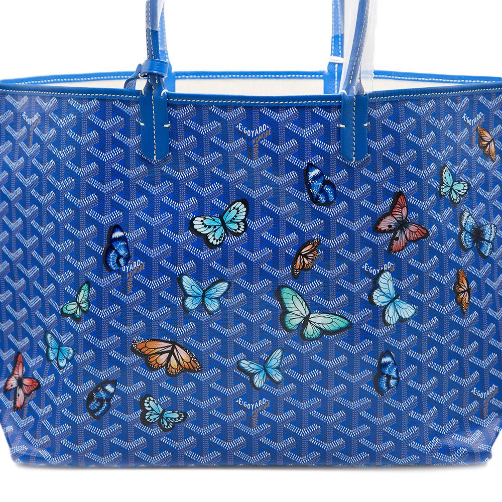 A handbag to truly set your heart aflutter, this blue Monogram St Louis tote Bag was crafted from Goyardine Canvas, a coloured textile made from cotton, linen and hemp, and vitalised by a flurry of hand-painted butterflies, in a mix of refined
