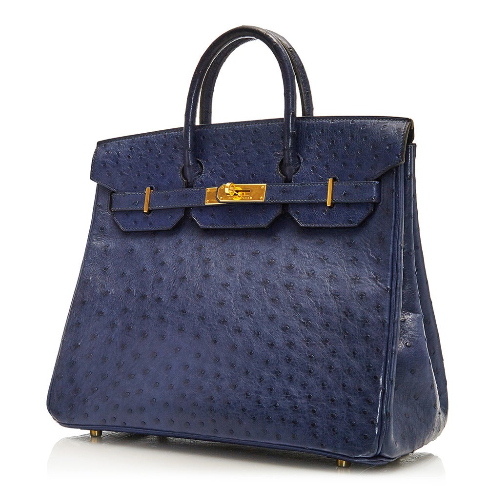 The combination of the classic style mixed with are materials makes this Birkin an excellent example of how to create a piece that is timeless, and effortless. Crafted in 1996 and featuring an exquisite navy ostrich leather, this 32cm piece from