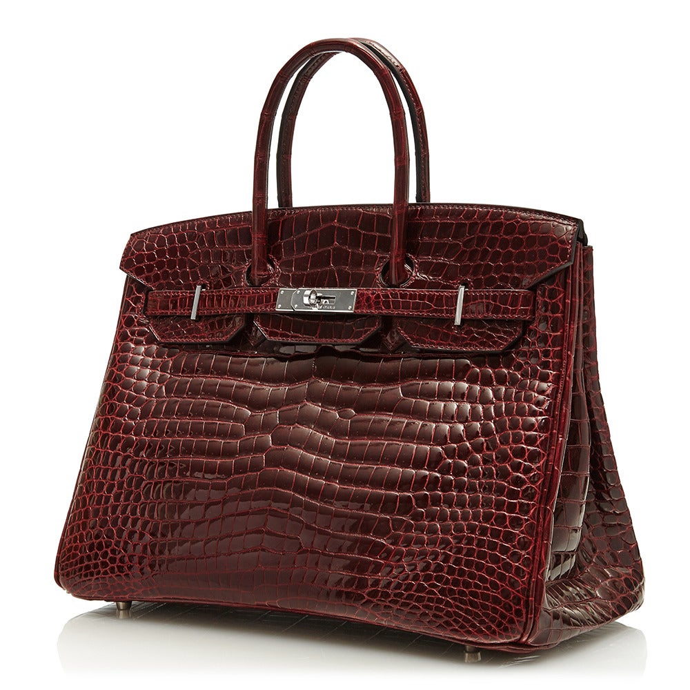 Another addition to the elevated range of Birkin bags from Hermès includes this bordeaux crocodile leather piece. The understated colour of the leather is enhanced by the silver-tone hardware. Additionally the bag features a large internal pocket