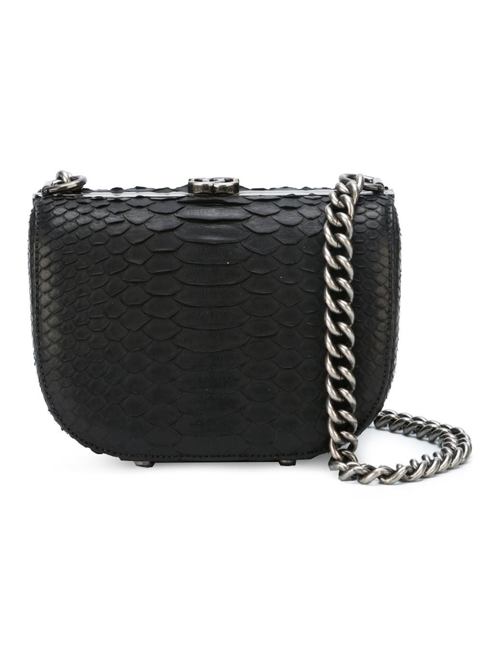 This black python skin small box shoulder bag from Chanel featuresa silver-tone logo plaque, a top clasp fastening, a chain and leather strap, an internal slip pocket and an internal logo plaque.

Colour: Black

Material: Python

Measurements: