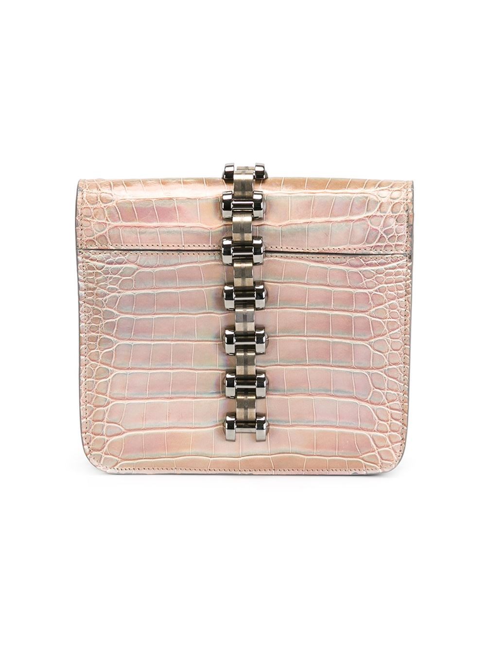 This beige crocodile leather metal embellished shiny clutch from Balenciaga features foldover top with twist-lock closure, an internal slip pocket and an internal logo patch.

Colour: Beige

Material: Crocodile Leather

Measurements: height: