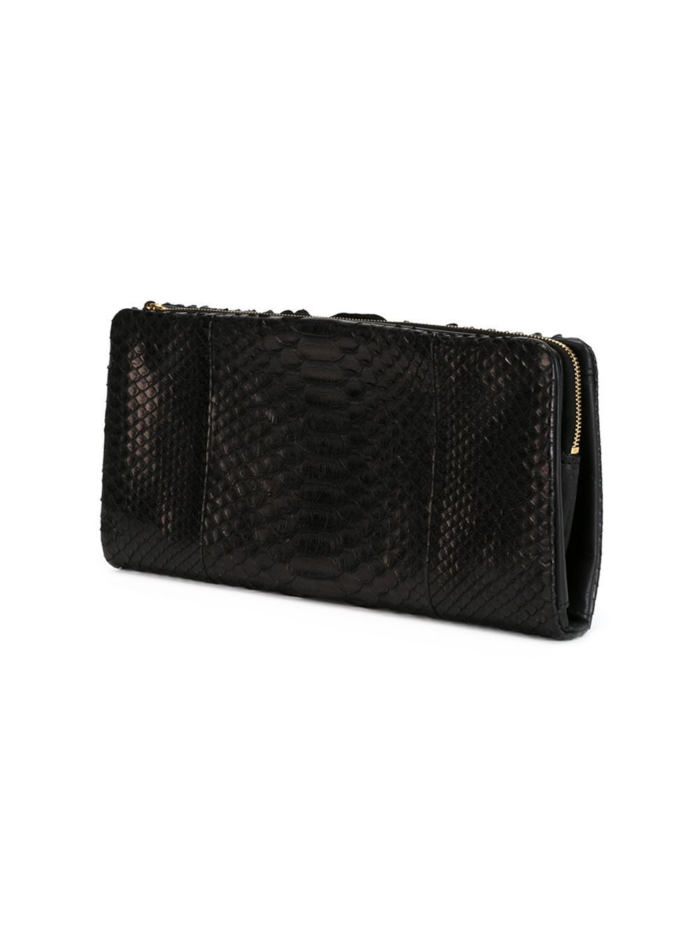 This black python skin evening clutch from Céline features an all around zip fastening, a snap button closure, internal zipped pockets and an embossed internal logo stamp.

Colour: Black

Material: Python

Measurements: width: 28 centimetres,