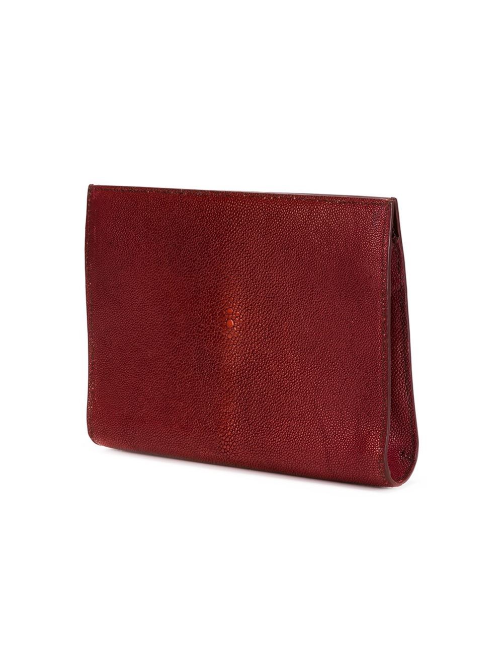 This red stingray flat clutch from Alaïa an internal slip pocket and a removable mirror.

Colour: Red

Material: Stingray

Measurements: height: 17 centimetres, depth: 3 centimetres, width: 23 centimetres

Condition: 9 out of 10
Excellent