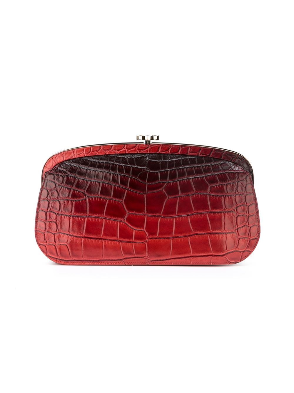 This red crocodile leather embossed clutch from Chanel features a top clasp fastening, a gold-Tone logo plaque, an internal zipped pocket and an internal logo plaque.