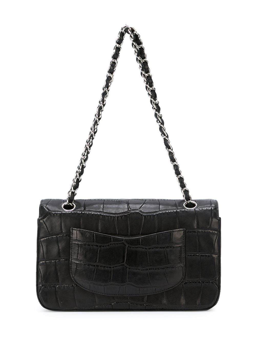 This black crocodile leather flap shoulder bag from Chanel features a top with twist-lock closure, a silver-tone logo plaque, a chain and leather strap, a back slip pocket, an internal logo plaque, an internal zipped pocket, an internal flap closure