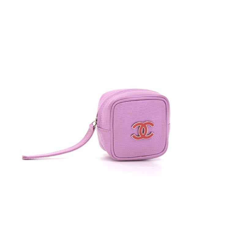 Chanel Vintage Leather Pouch. This leather pouch from Chanel is a charming addition to your accessories collection. Made from a fun-loving supple purple leather, this piece has a zip fastening and is accented with a classic CC logo.

Measurements: