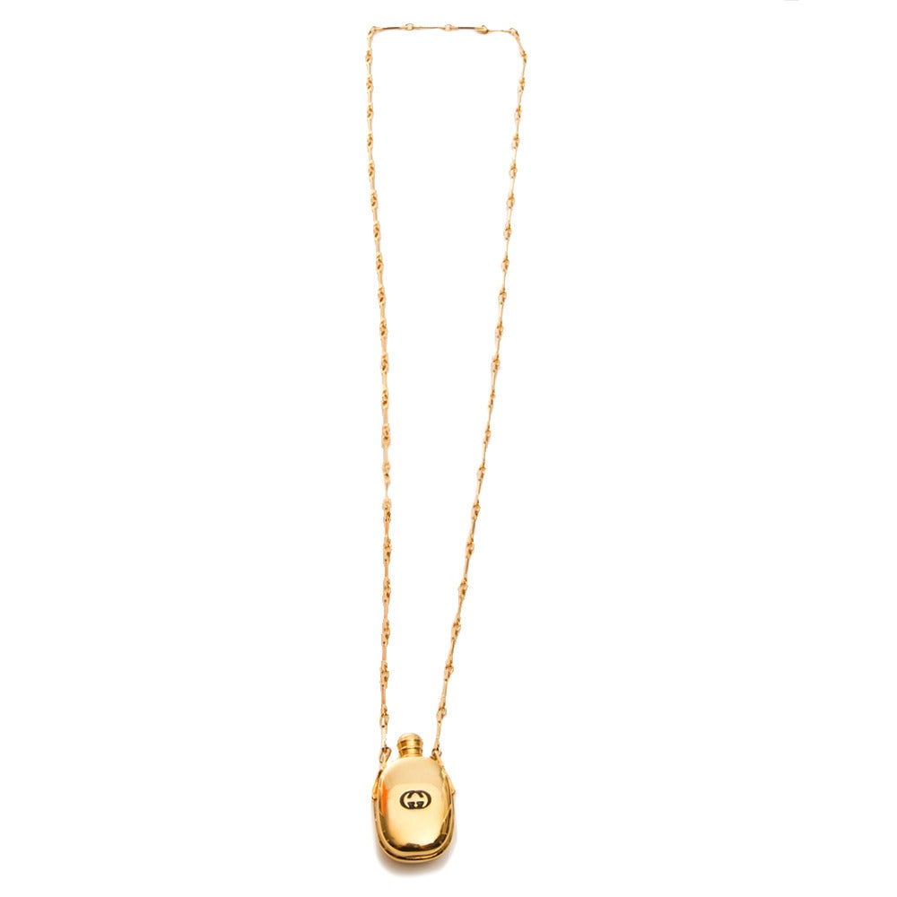 Rare gold- plated Gucci necklace featuring a logo and a fine chain. This necklace doubles as a perfect vessel to always have your favourite fragrance at hand. The screw top is embossed with 'Gucci Italy.'

Colour: Gold
Material: Gold- plated