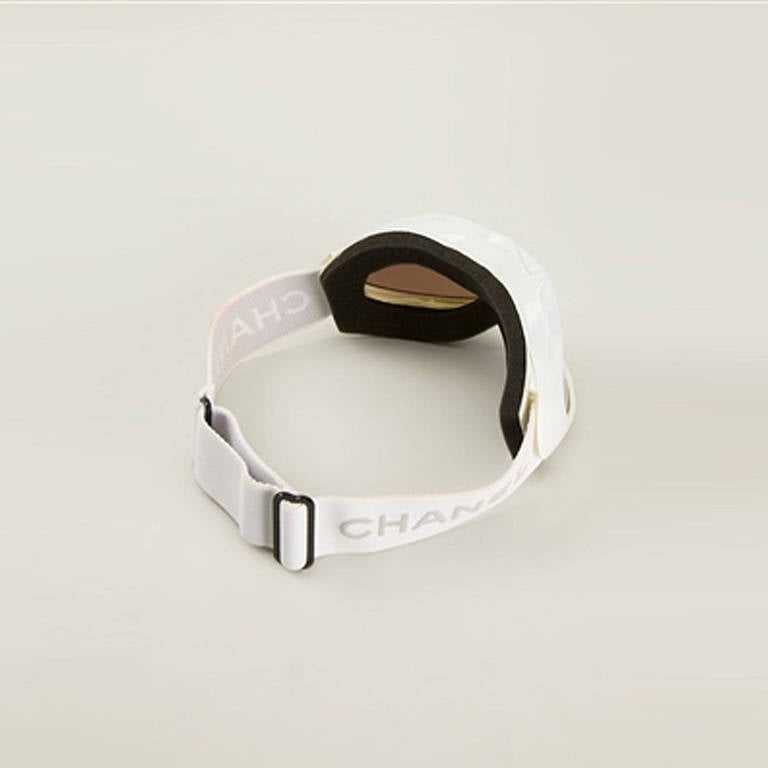 Chanel Vintage Ski Goggles. Take the sports luxe trend to the next level with these white sports sunglasses from Chanel Vintage, accented with the classic CC logo at the frame and featuring a branded adjustable fit and dark tinted lenses.

Colour: