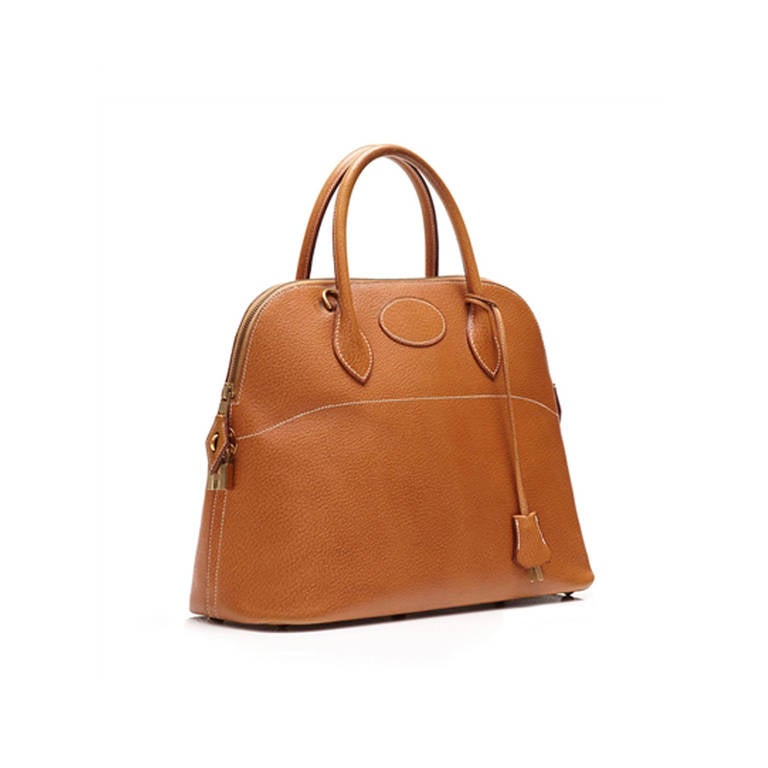 Hermès Vintage Bolide Tan Leather Bag. Bolide handbag from Hermès, a sought after model which was first created by Hermes in 1922 and was the first bag ever to incorporate a zipper. Crafted in tan Epsom Leather and lined with a super- supple leather
