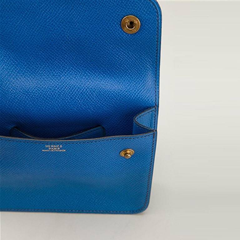 Hermes Vintage Mini Belt Pouch. Perfect for summer strolls, this delightful blue leather mini belt pouch from Hermès Vintage features a back tie fastening, a square body, a front flap closure, a press stud fastening, a pebbled leather texture, an