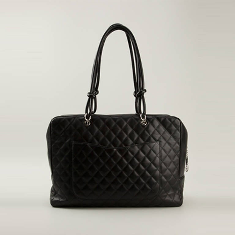 Chanel Qulited 'Cambon' Extra Large Tote Bag. This oversize Cambon tote has a sports-luxe appeal and is great for toting your essentials to the gym, or even as a small weekend bag. It features a black quilted lambskin leather exterior with matching