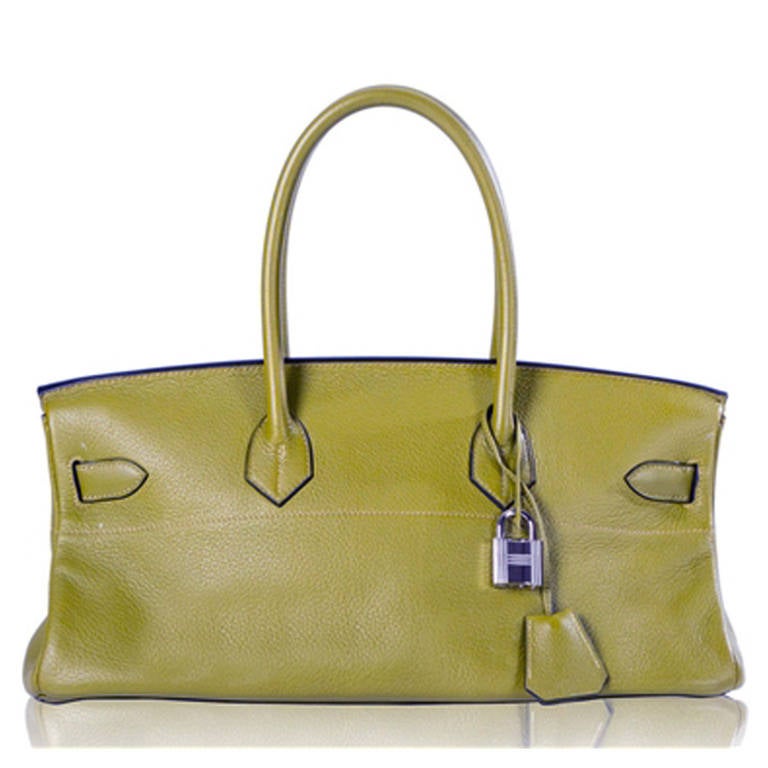 Hermès Shoulder Birkin Bag. Hermès Shoulder Birkin bag in Olive Green Togo leather. The bag's hardware is palladium and it has two interior pockets one of which is zipped. This classic bag comes with its its original dust-bag, lock and