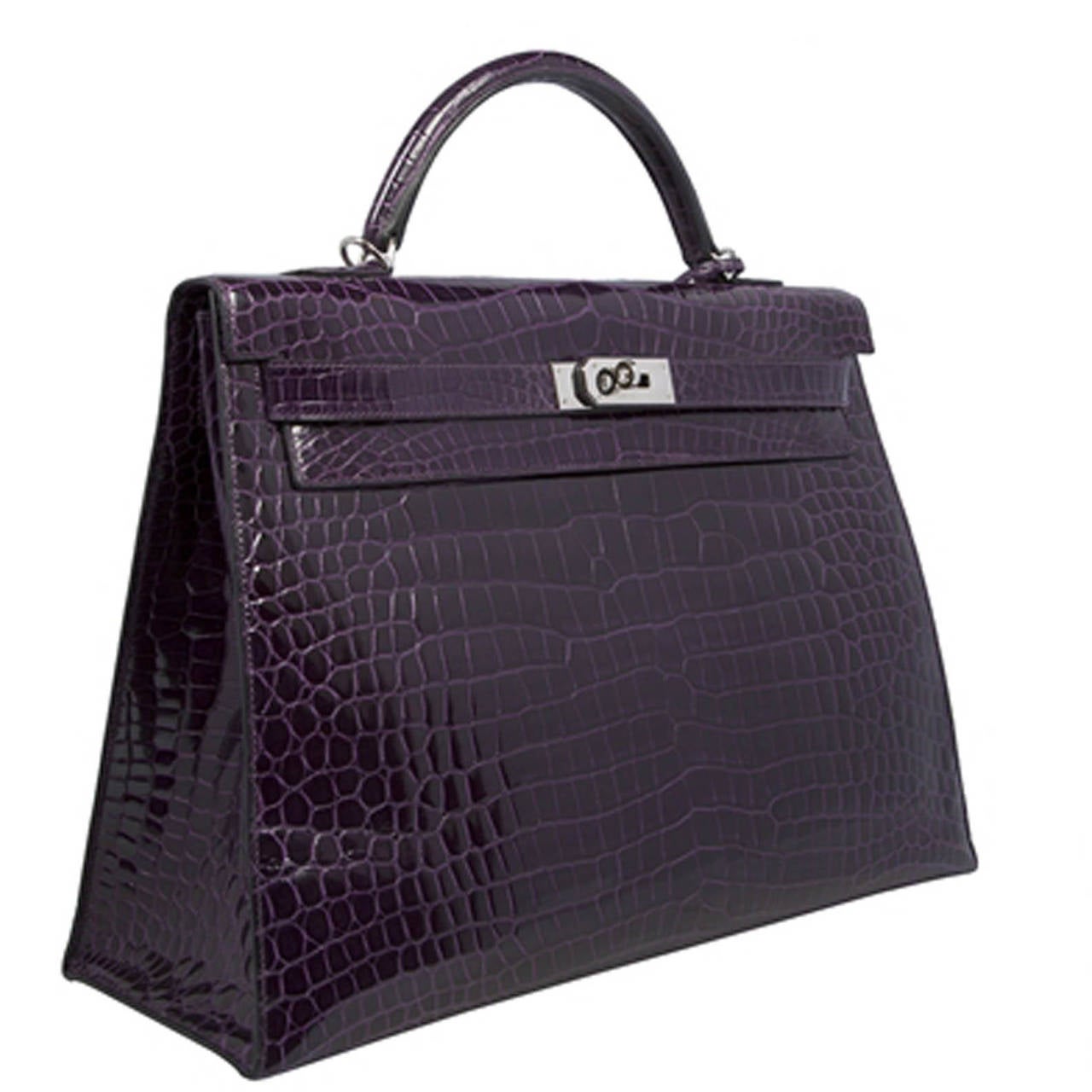 Hermes 40cm Amethyst Crocodile Kelly Shoulder Bag.Invest in a classic with this Hermes Kelly, crafted in Crocodile Leather in an alluring Amethyst colour. Features a single flat top handle, a branded palladium twist-lock hardware, protective